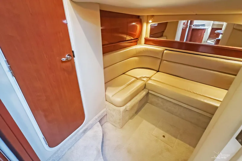 Slide: The Image of Interior of 2003 Sea Ray 420 Sundancer yacht with beige leather seating. - 22