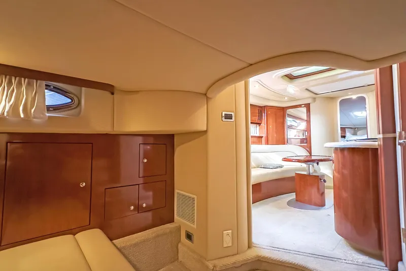 Slide: The Image of Luxurious interior of 2003 Sea Ray 420 Sundancer yacht with elegant wood finishes. - 23