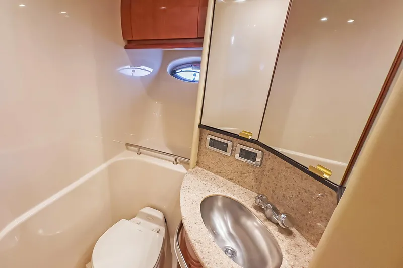 Slide: The Image of Luxurious bathroom in 2003 Sea Ray 420 Sundancer yacht with modern fixtures. - 24