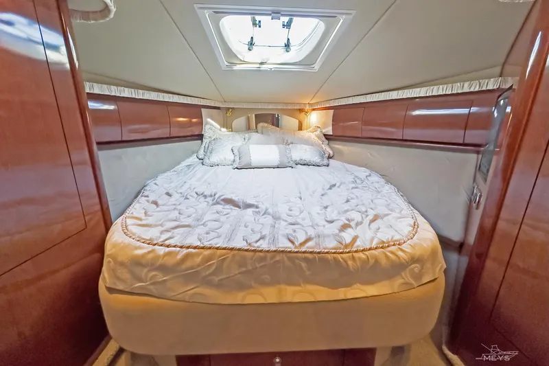 Slide: The Image of Luxurious cabin interior of 2003 Sea Ray 420 Sundancer yacht with elegant bedding. - 25