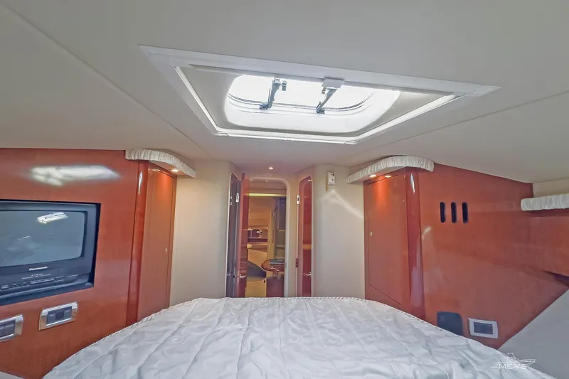 Slide: The Image of Interior cabin of 2003 Sea Ray 420 Sundancer yacht with skylight and TV. - 26