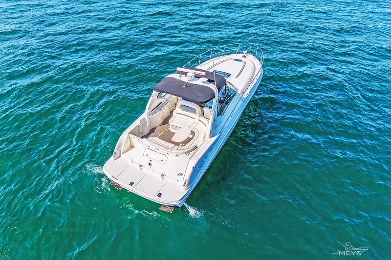 Slide: The Image of Aerial view of 2003 Sea Ray 420 Sundancer yacht cruising on blue ocean waters. - 5