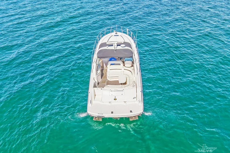 Slide: The Image of Aerial view of 2003 Sea Ray 420 Sundancer yacht on clear blue water. - 6