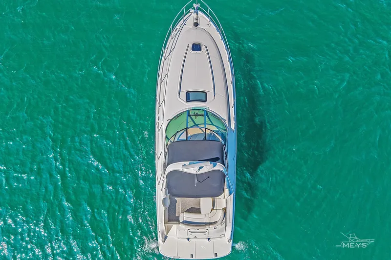 Slide: The Image of Top view of 2003 Sea Ray 420 Sundancer yacht on turquoise water. - 8