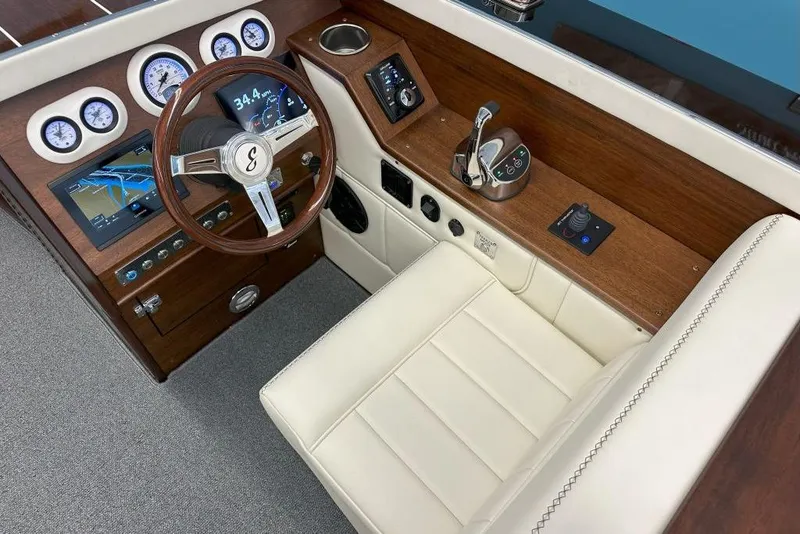 Slide: The Image of Interior of 2025 StanCraft 260 Day Boat with wood dashboard and modern controls. - 10
