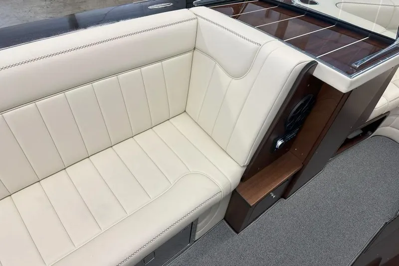 Slide: The Image of Luxurious seating on 2025 StanCraft 260 Day Boat with cream upholstery and wood accents. - 11
