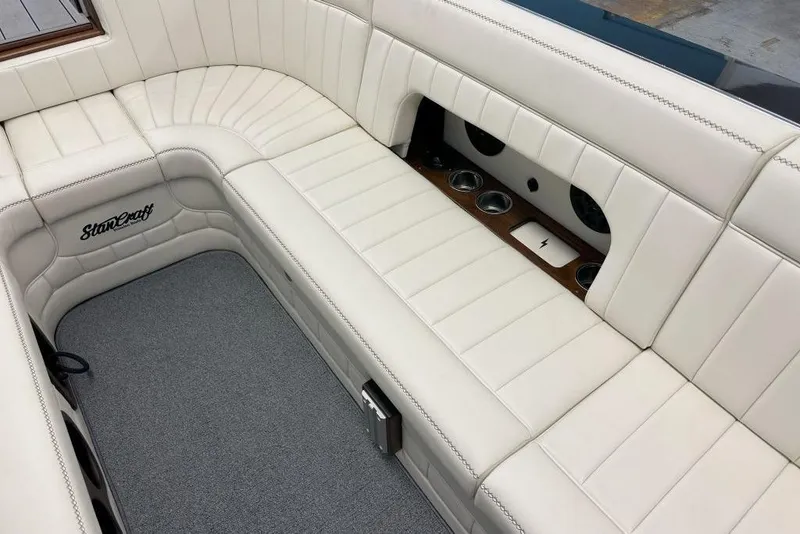 Slide: The Image of Luxurious interior of 2025 StanCraft 260 Day Boat with white leather seating and cup holders. - 12