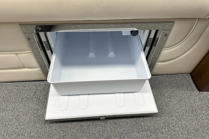 Slide: The Image of Open storage compartment in 2025 StanCraft 260 Day Boat, featuring sleek interior design. - 15