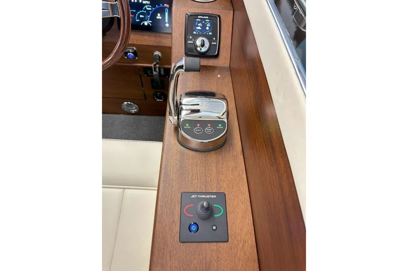 Slide: The Image of 2025 StanCraft 260 Day Boat dashboard with controls and jet thruster. - 16