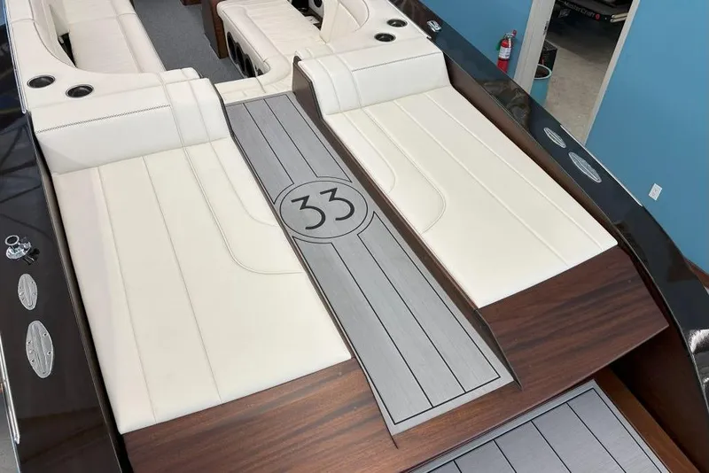 Slide: The Image of 2025 StanCraft 260 Day Boat interior with elegant white seating and wood accents. - 5