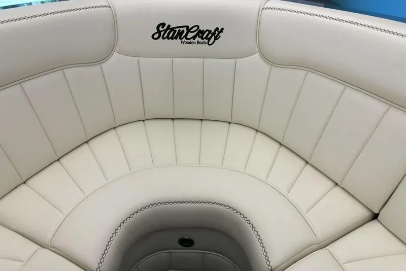 Slide: The Image of Luxurious seating in 2025 StanCraft 260 Day Boat, featuring elegant white upholstery. - 7