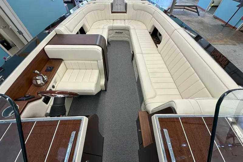 Slide: The Image of Luxurious interior of 2025 StanCraft 260 Day Boat with elegant seating and wood accents. - 8