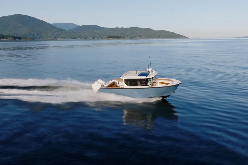 Slide: The Image of 2026 Jasper Marine Defender 22 speeding on open water. - 5