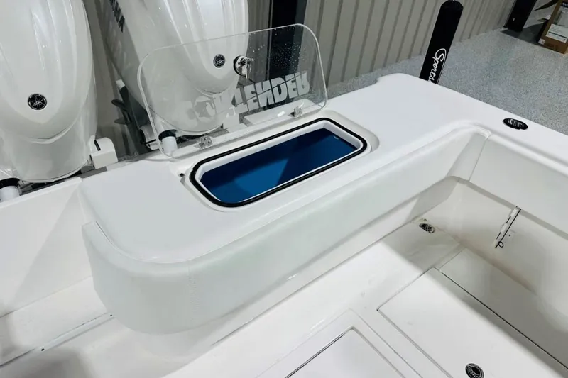 Slide: The Image of 2025 Contender 28 Tournament boat interior with livewell and dual engines. - 11