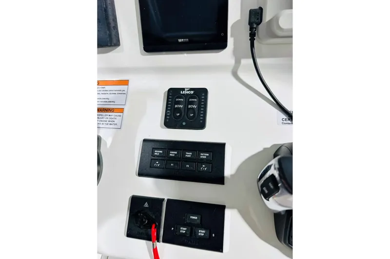 Slide: The Image of Control panel of 2025 Contender 28 Tournament boat with Yamaha display and Lenco trim tab controls. - 3