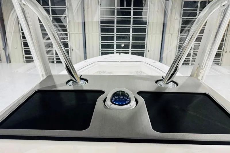 Slide: The Image of 2025 Contender 28 Tournament boat dashboard with compass and stainless steel supports. - 5