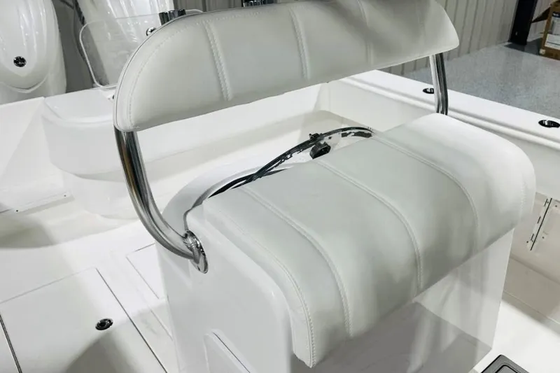 Slide: The Image of 2025 Contender 28 Tournament boat with white cushioned seating and stainless steel frame. - 6