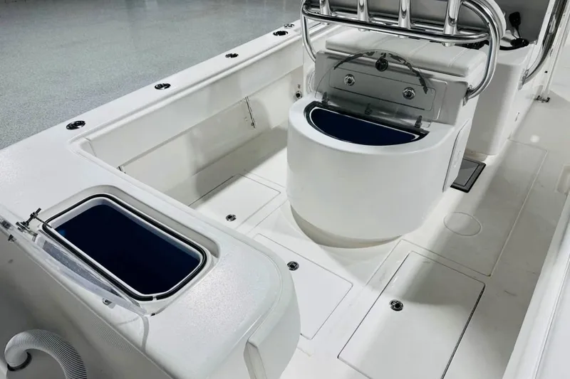 Slide: The Image of 2025 Contender 28 Tournament boat interior with livewell and storage compartments. - 8