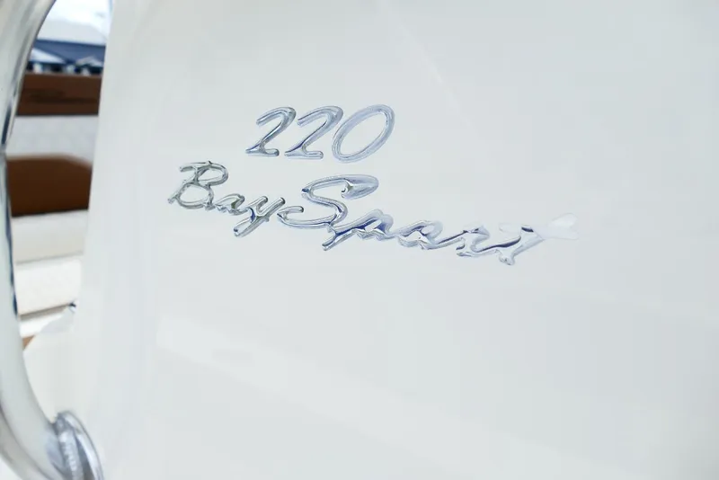 Slide: The Image of Close-up of 2026 Pioneer 220 Bay Sport logo on white surface. - 11