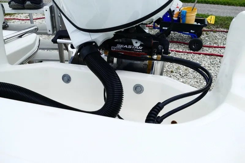 Slide: The Image of Close-up of 2026 Pioneer 220 Bay Sport boat's steering mechanism and cables. - 2