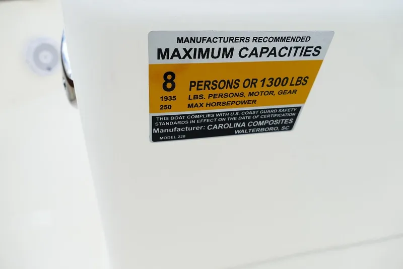 Slide: The Image of 2026 Pioneer 220 Bay Sport capacity label, 8 persons or 1300 lbs, max 250 horsepower. - 3