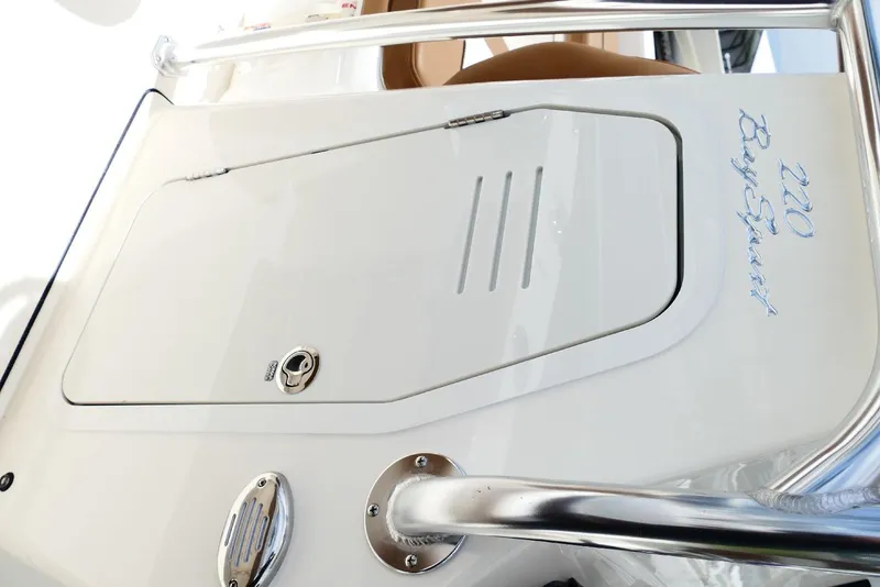 Slide: The Image of 2026 Pioneer 220 Bay Sport boat hatch with sleek design and chrome accents. - 32