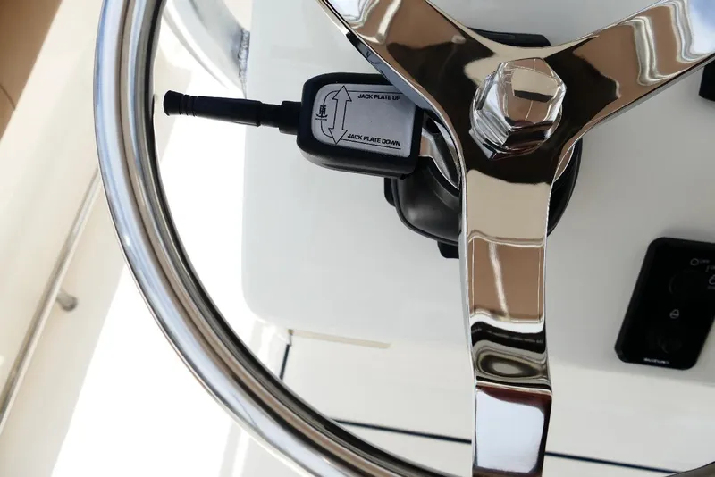 Slide: The Image of Steering wheel and controls of 2026 Pioneer 220 Bay Sport boat. - 34