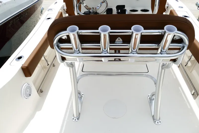 Slide: The Image of 2026 Pioneer 220 Bay Sport boat interior with rod holders and seating. - 47