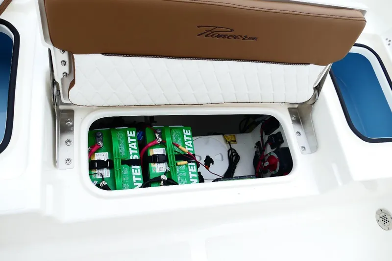 Slide: The Image of 2026 Pioneer 220 Bay Sport boat battery compartment with Interstate batteries and wiring. - 57