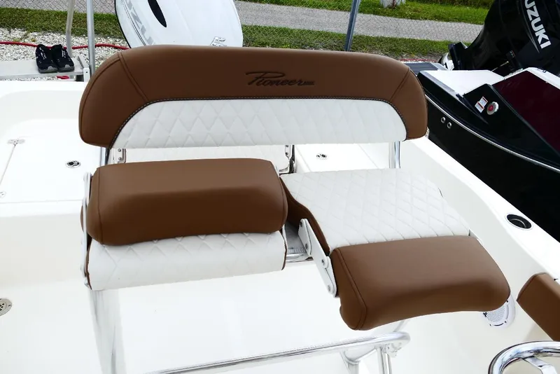 Slide: The Image of Brown and white cushioned seat on 2026 Pioneer 220 Bay Sport boat. - 61
