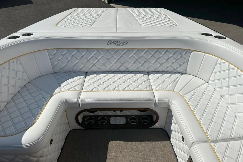 Slide: The Image of Luxurious white leather seating on 2017 StanCraft 320 Rivelle boat interior. - 10