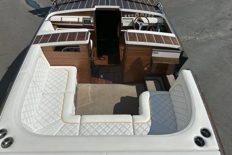 Slide: The Image of Luxurious 2017 StanCraft 320 Rivelle boat interior with elegant white seating and wood accents. - 11
