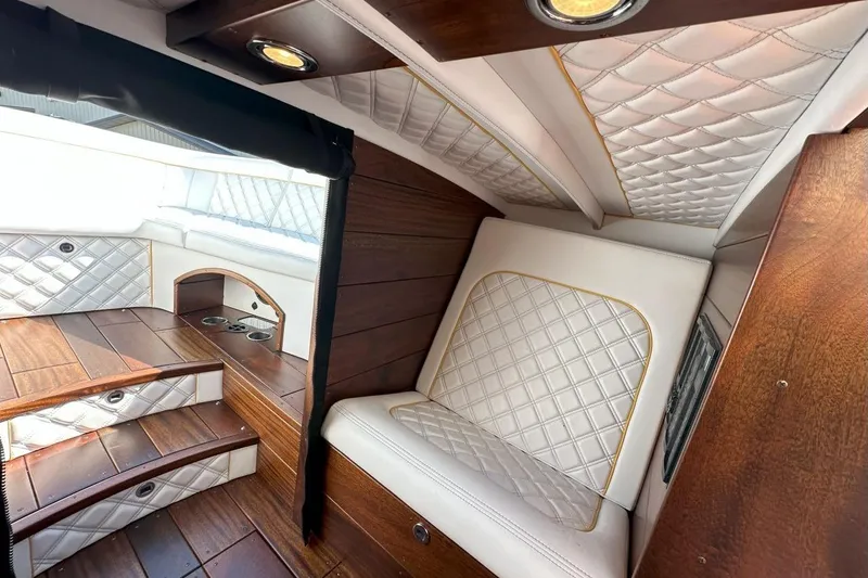 Slide: The Image of Luxurious interior of 2017 StanCraft 320 Rivelle with quilted leather and wood accents. - 17