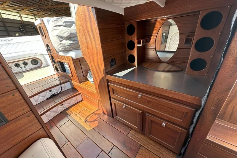 Slide: The Image of Luxurious 2017 StanCraft 320 Rivelle interior with elegant wood finish and built-in storage. - 18