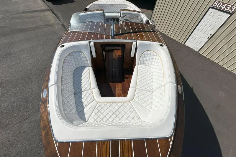 Slide: The Image of 2017 StanCraft 320 Rivelle boat with luxurious white seating and wooden deck. - 21