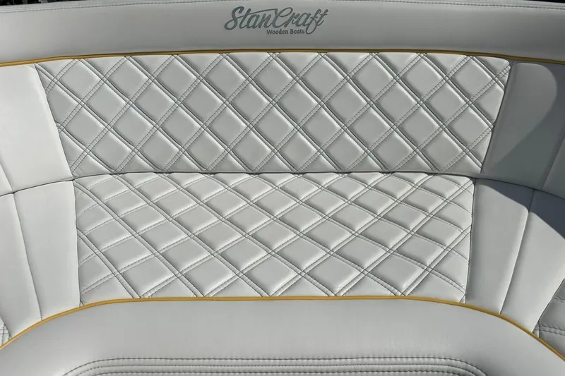 Slide: The Image of Quilted white leather seat of 2017 StanCraft 320 Rivelle boat, featuring elegant diamond pattern. - 22