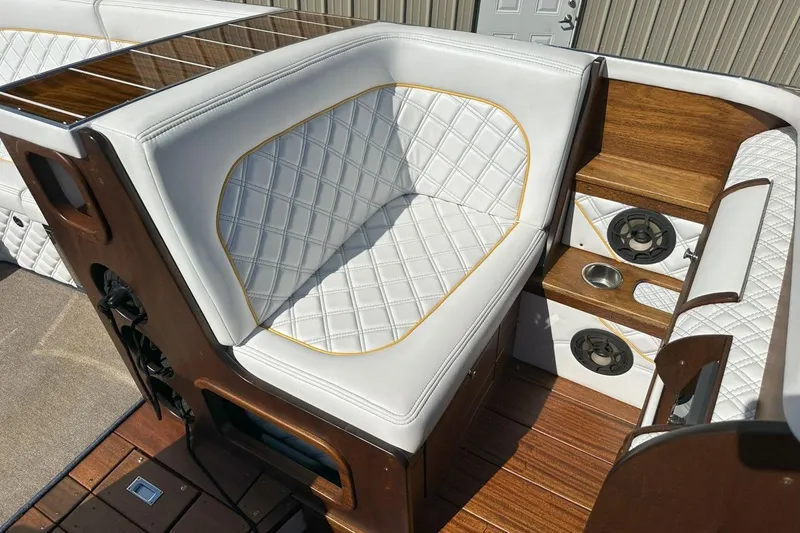 Slide: The Image of Luxurious 2017 StanCraft 320 Rivelle boat interior with white quilted seating and wood accents. - 7