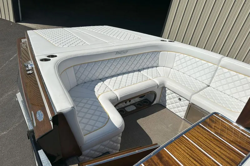 Slide: The Image of Luxurious white leather seating on 2017 StanCraft 320 Rivelle boat, featuring elegant diamond stitching. - 8