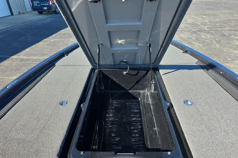 Slide: The Image of Open storage compartment of 2025 iKon VLX 21 boat, showcasing interior space. - 15