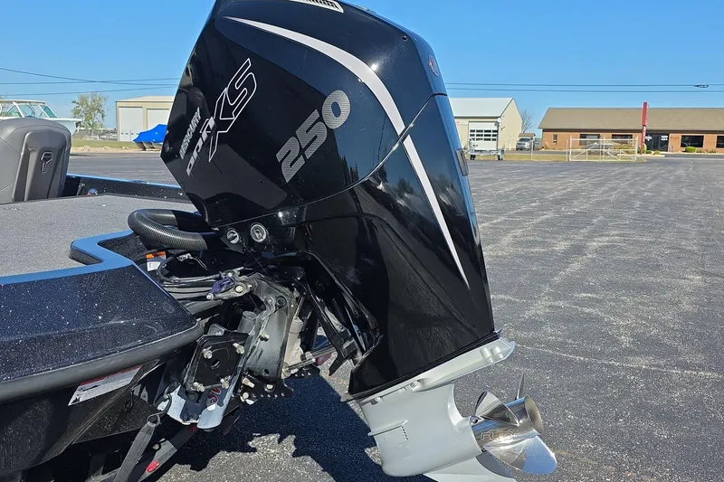 Slide: The Image of Outboard motor on iKon VLX 21 boat, 2025 model, in a parking lot. - 5