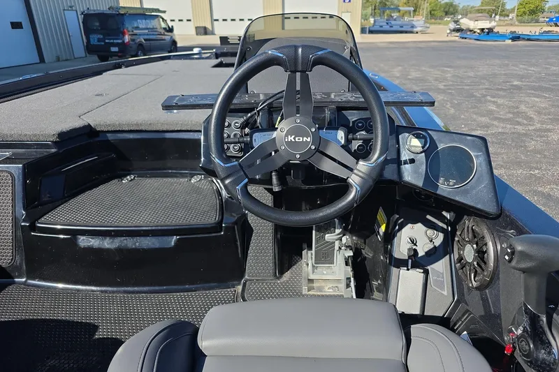 Slide: The Image of 2025 iKon VLX 21 boat cockpit with steering wheel and control panel. - 7
