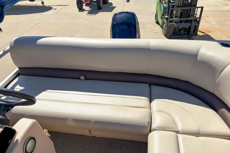 Slide: The Image of 2019 Sun Tracker Bass Buggy 16 DLX pontoon boat with beige seating. - 10