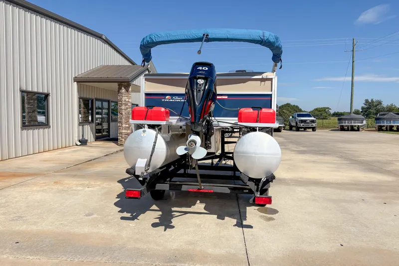 Slide: The Image of 2019 Sun Tracker Bass Buggy 16 DLX pontoon boat on trailer, rear view. - 3