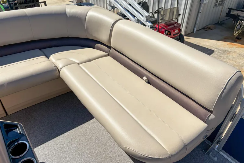 Slide: The Image of 2019 Sun Tracker Bass Buggy 16 DLX pontoon boat with beige seating and cup holders. - 8