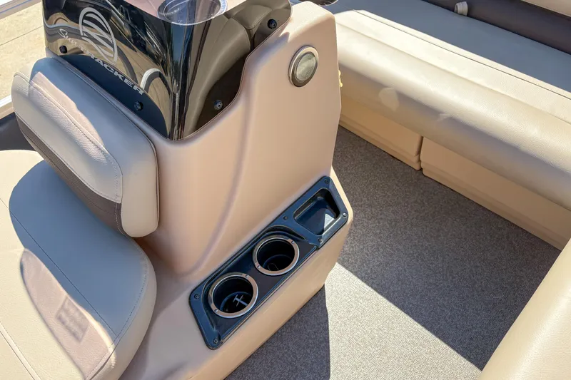 Slide: The Image of 2019 Sun Tracker Bass Buggy 16 DLX interior with beige seating and cup holders. - 9