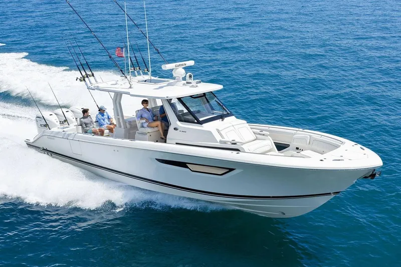 Slide: The Image of Manufacturer Provided Image: 2026 Pursuit S 388 Sport boat cruising on open blue ocean waters. - 1