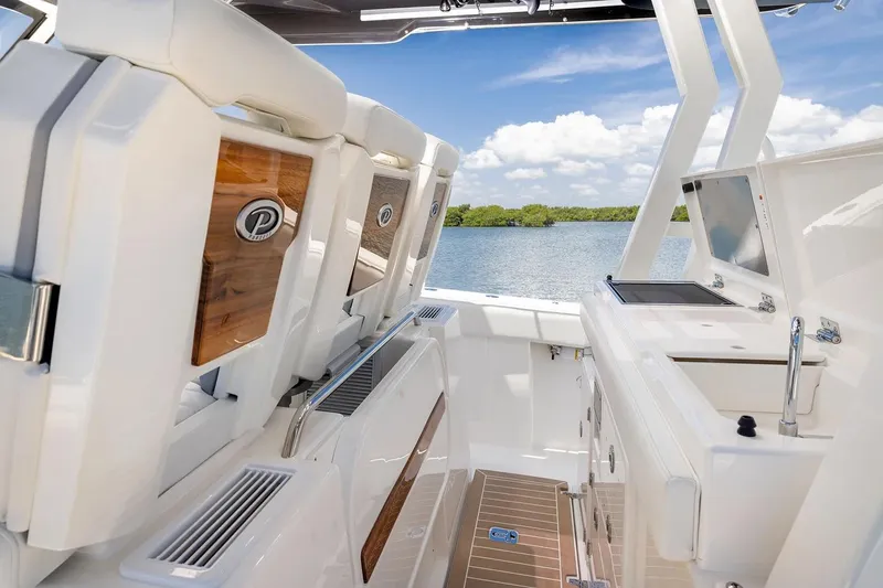 Slide: The Image of Manufacturer Provided Image: 2026 Pursuit S 388 Sport boat interior with luxurious seating and sleek design. - 10