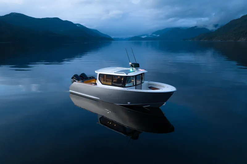 Slide: The Image of Aerial view of 2026 Jasper Marine Defender 22 boat speeding on water. - 14