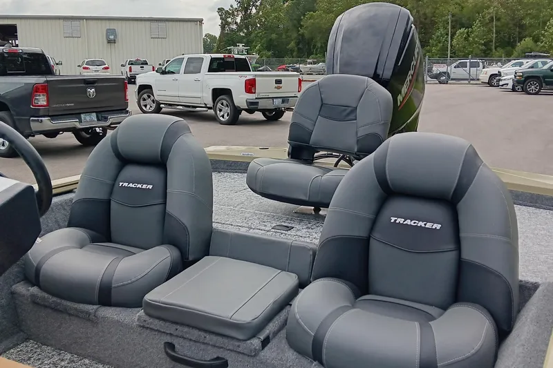 Slide: The Image of 2026 Tracker Pro Team 175 boat interior with comfortable seating and Mercury engine. - 12