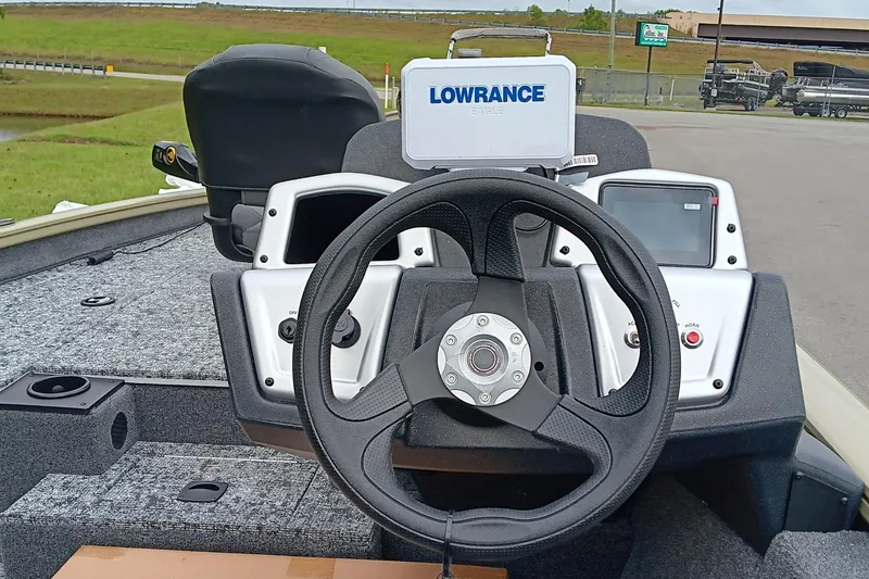Slide: The Image of Steering console of 2026 Tracker Pro Team 175 boat with Lowrance electronics. - 13
